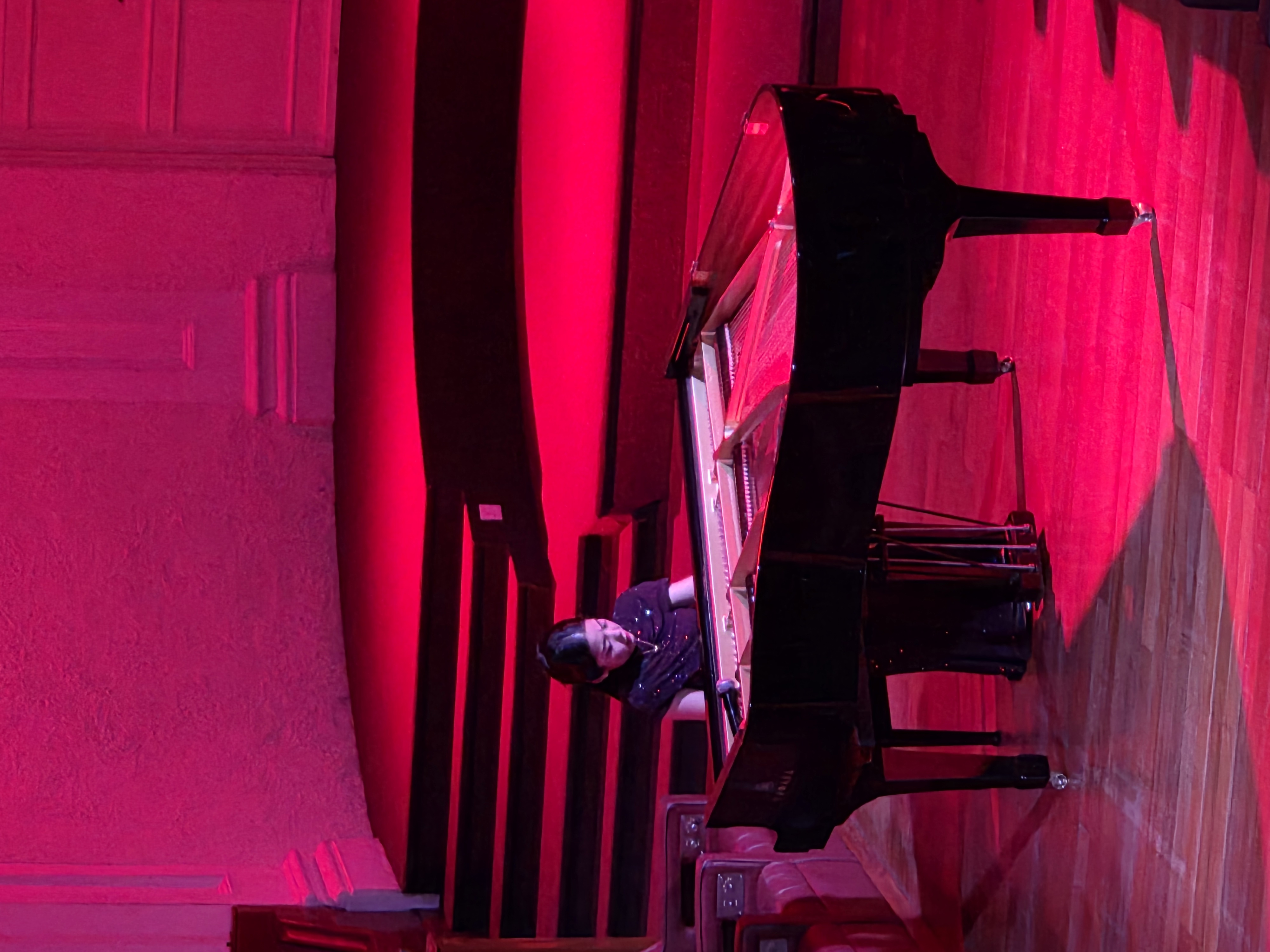 Churen Li playing on piano during Chopin vs AI recital