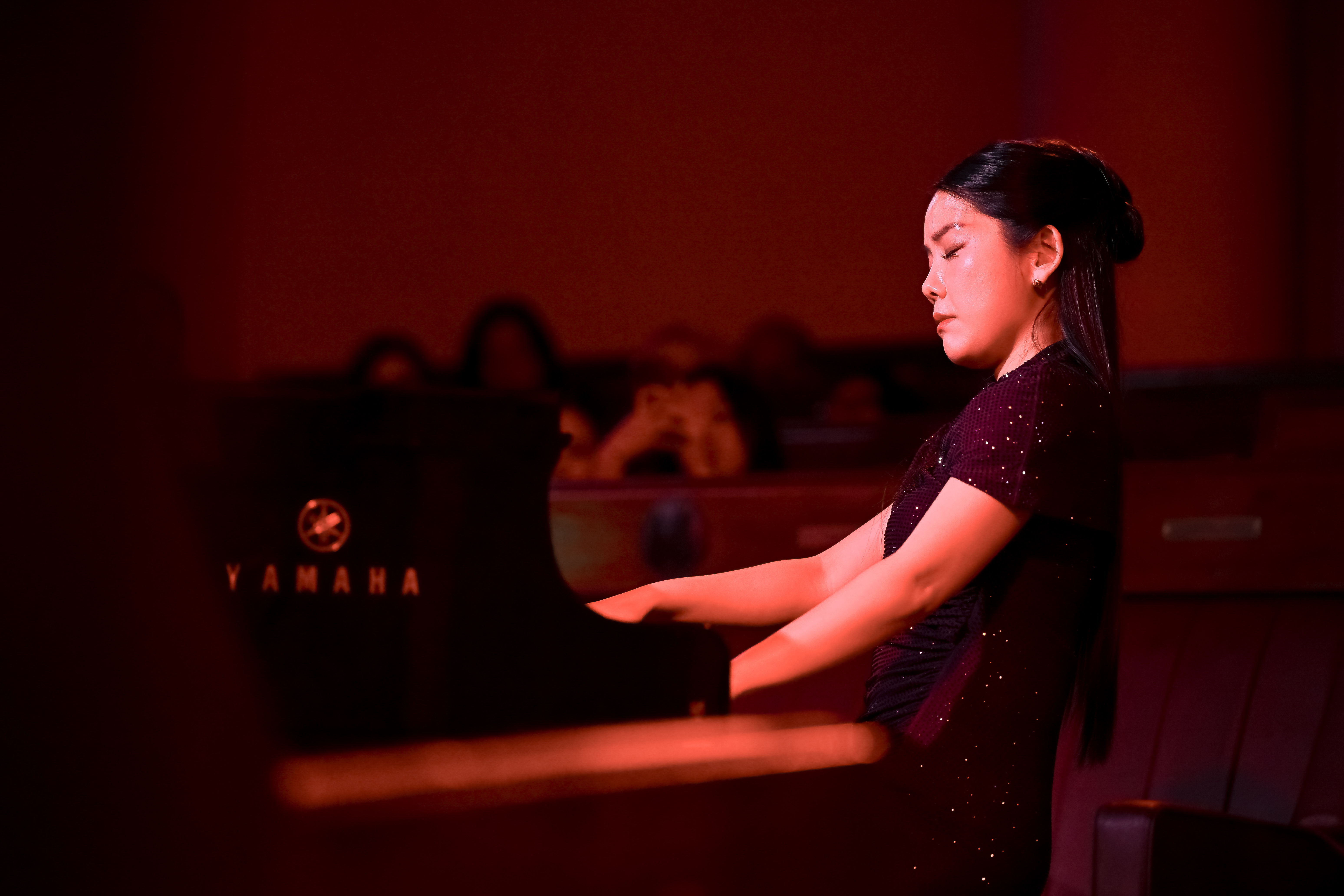 close-up of Churen Li playing piano during Chopin vs AI recital